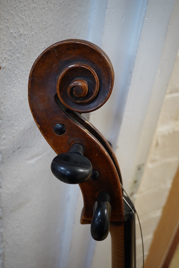 An early to mid 19th century German cello, attributed to Simon Voigt, Simon Voigt label inside with indistinct date, body 74.5cm, with a hard case. Condition - fair to good.